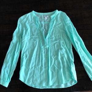 Teal colored blouse